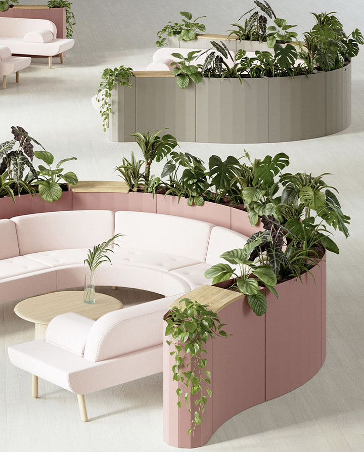 A standalone or modular planter collection featuring soft undulating curves, gentle visual facets, and optional bonus surfaces; perfect for incorporating biophilia, creating quick touchdown points, and dividing spaces with a minimal footprint.