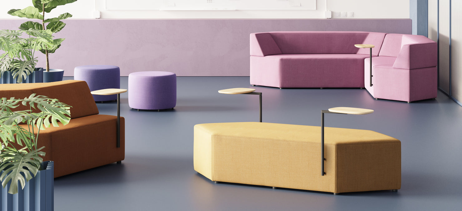 Prism Modular Seating system with a single 82-inch bench, paired with Tess Planters and small side tables in a modern hospitality space.